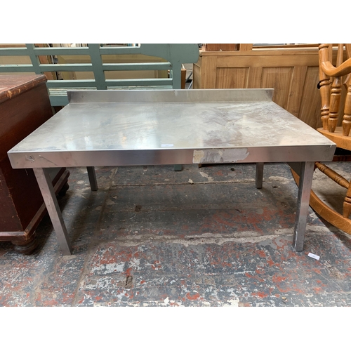 197 - A stainless steel rectangular table - approx. 52cm high x 100cm wide x 60cm deep