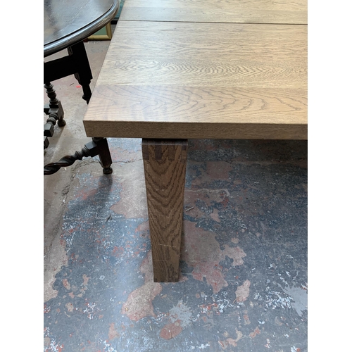 199 - A modern oak rectangular dining table - approx. 74cm high x 101cm wide x 220cm long