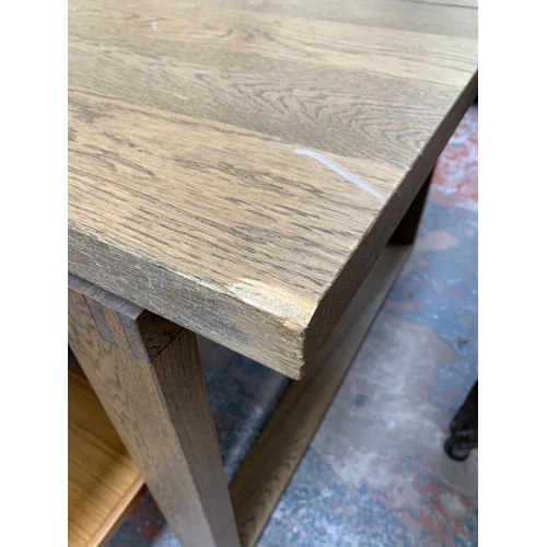 199 - A modern oak rectangular dining table - approx. 74cm high x 101cm wide x 220cm long