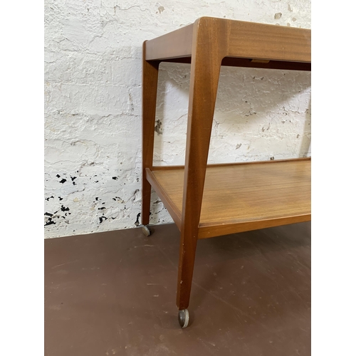 204 - A mid 20th century Remploy teak two tier drinks trolley - approx. 67cm high x 43cm wide x 82cm long
