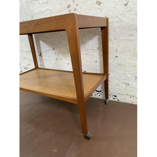 204 - A mid 20th century Remploy teak two tier drinks trolley - approx. 67cm high x 43cm wide x 82cm long
