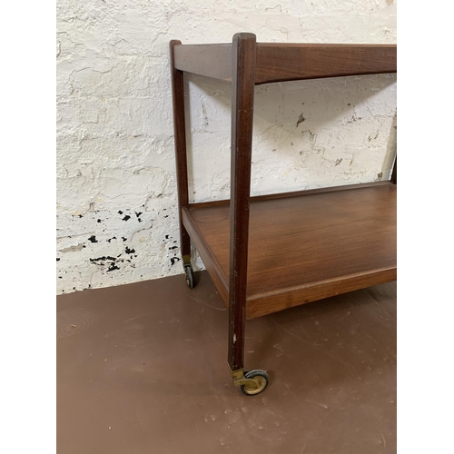 205 - A mid 20th century teak two tier drinks trolley - approx. 65cm high x 46cm wide x 76cm long