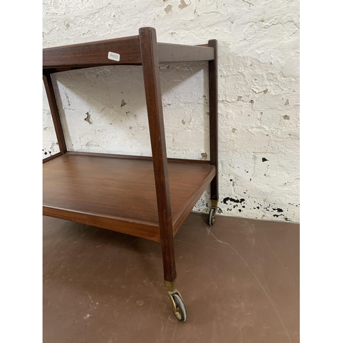 205 - A mid 20th century teak two tier drinks trolley - approx. 65cm high x 46cm wide x 76cm long