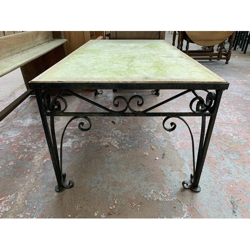 212 - A wrought iron and stone top rectangular outdoor table - approx. 44cm high x 57cm wide x 108cm long