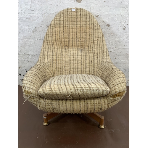 213 - A mid 20th century Greaves & Thomas fabric upholstered egg shaped lounge chair - approx. 93cm high x... 