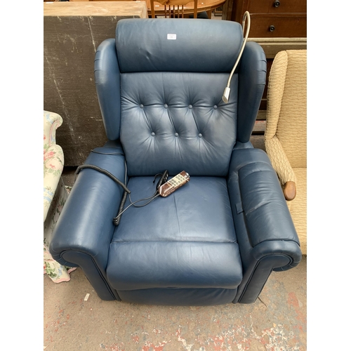 216 - A Willowbrook blue leather electric rise and recline armchair with remote control and reading light