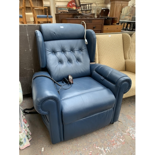 216 - A Willowbrook blue leather electric rise and recline armchair with remote control and reading light