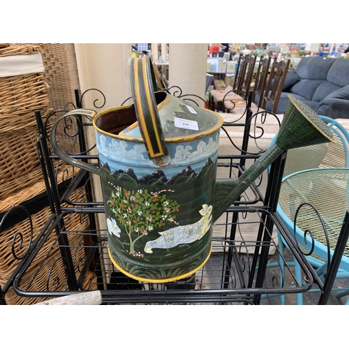 219 - Six items to include barge style hand painted galvanized watering can, pair of tubular black metal t... 