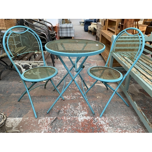 220 - A mid 20th century style blue tubular metal three piece patio set