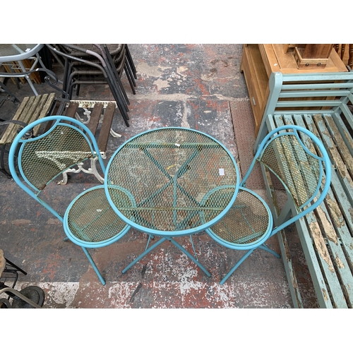 220 - A mid 20th century style blue tubular metal three piece patio set