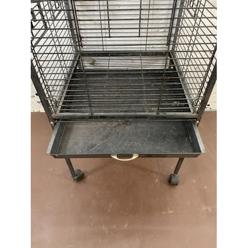 228 - A large grey metal bird cage on castors - approx. 157cm high x 56cm wide x 56cm deep