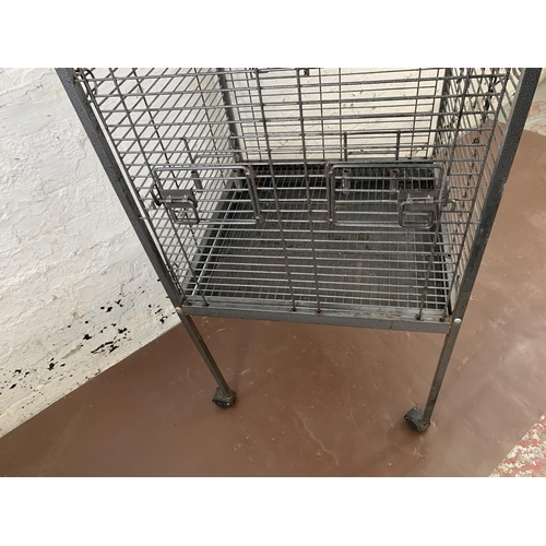 228 - A large grey metal bird cage on castors - approx. 157cm high x 56cm wide x 56cm deep