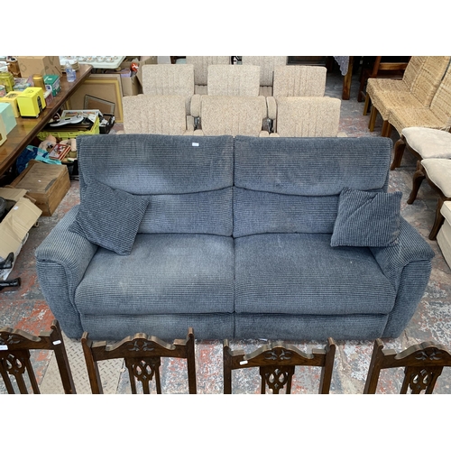 239 - A modern grey fabric upholstered three seater reclining sofa - approx. 100cm high x 205cm long x 78c... 