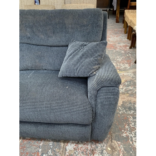 239 - A modern grey fabric upholstered three seater reclining sofa - approx. 100cm high x 205cm long x 78c... 