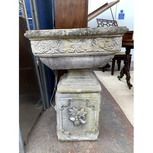 245 - A cast stone pedestal garden planter - approx. 80cm high