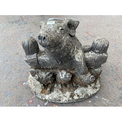 247 - A cast stone pig and piglets garden figurine