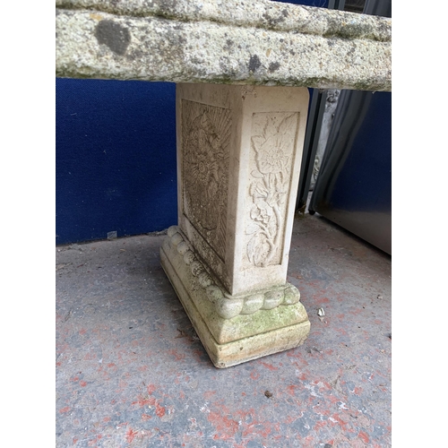 251 - A cast stone pedestal garden bench - approx. 42cm high x 114cm wide x 38cm deep