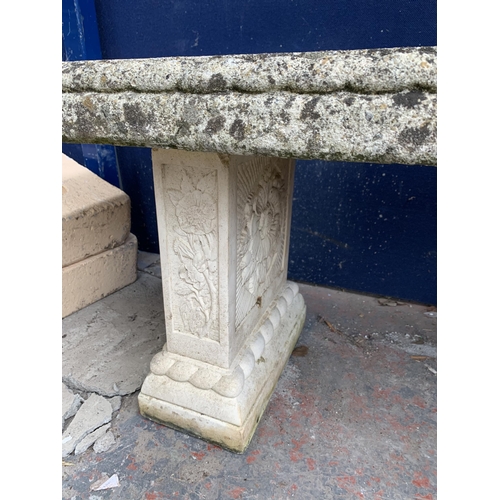 251 - A cast stone pedestal garden bench - approx. 42cm high x 114cm wide x 38cm deep