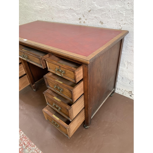 39 - A Victorian Aesthetic Movement walnut pedestal writing desk with red leather insert - approx. 72cm h... 