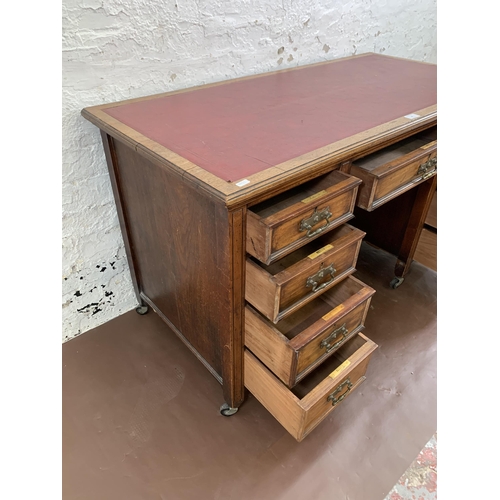 39 - A Victorian Aesthetic Movement walnut pedestal writing desk with red leather insert - approx. 72cm h... 
