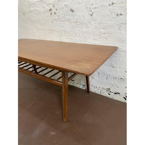 41 - A mid 20th century teak rectangular coffee table with lower magazine rack - approx. 49cm high x 50cm... 