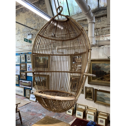 53 - A 1970s Boho style wicker and bamboo hanging egg chair