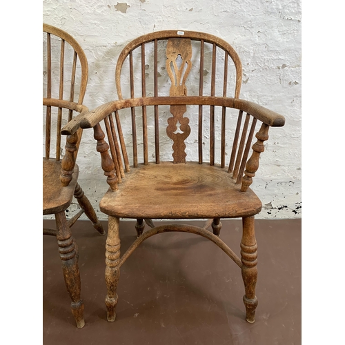 54 - A near pair of 19th century elm and beech Windsor armchairs