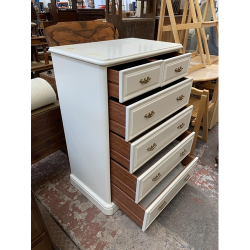 62 - An Olympus white painted chest of drawers