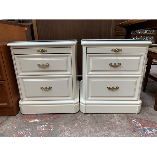 71 - A pair of Olympus white painted bedside chests of drawers - approx. 55cm high x 47cm wide x 47cm dee... 