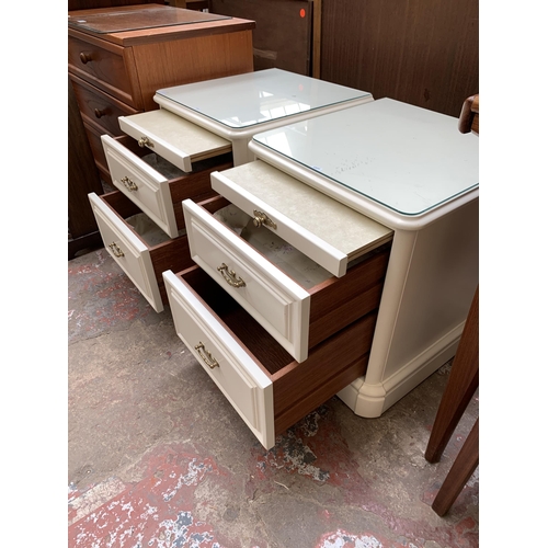 71 - A pair of Olympus white painted bedside chests of drawers - approx. 55cm high x 47cm wide x 47cm dee... 