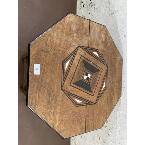 73 - An Art Deco inlaid mahogany octagonal two tier side table - approx. 58cm high x 53cm wide x 52cm dee... 