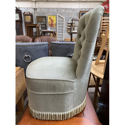 81 - A mid 20th century green button back fabric upholstered bedroom chair