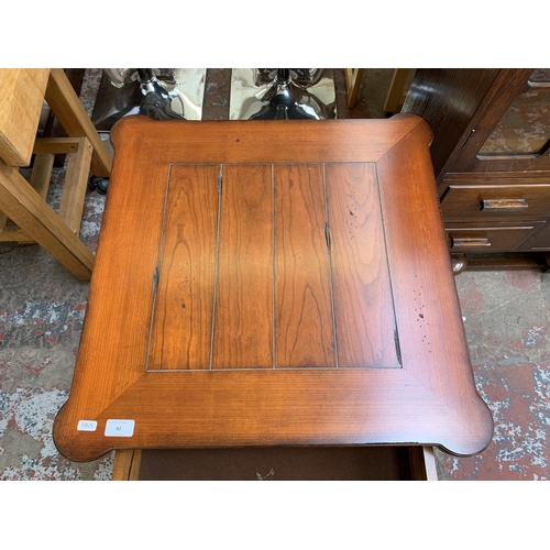 82 - A modern cherry wood two drawer lamp table - approx. 66cm high x 61cm wide x 61cm deep