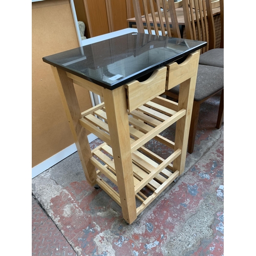 88 - A modern beech and black marble top kitchen trolley - approx. 75cm high x 49cm wide x 40cm deep
