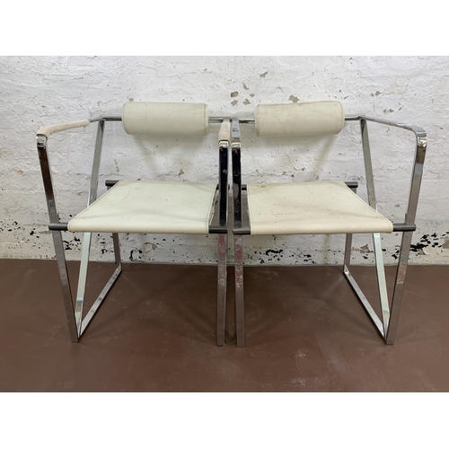 95 - A pair of Seconda style white faux leather and chrome plated armchairs after Mario Botta