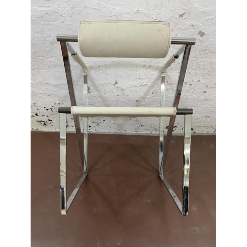 95 - A pair of Seconda style white faux leather and chrome plated armchairs after Mario Botta