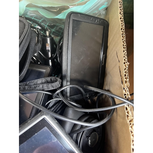 700 - A box containing a collection of satnavs to include Garmin, Tomtom, Navman etc.