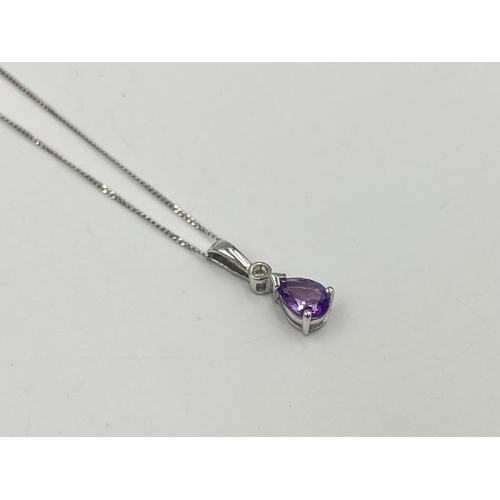 2289 - A 9ct white gold diamond and amethyst pendant necklace - approx. gross weight 1.40g and 40.5cm long