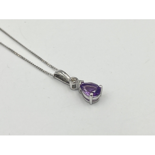 2289 - A 9ct white gold diamond and amethyst pendant necklace - approx. gross weight 1.40g and 40.5cm long