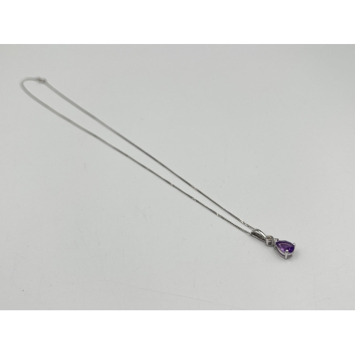 2289 - A 9ct white gold diamond and amethyst pendant necklace - approx. gross weight 1.40g and 40.5cm long