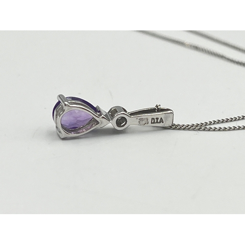 2289 - A 9ct white gold diamond and amethyst pendant necklace - approx. gross weight 1.40g and 40.5cm long