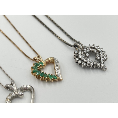 2290 - Four .925 silver heart shaped pendant necklaces to include garnet, CZ etc.