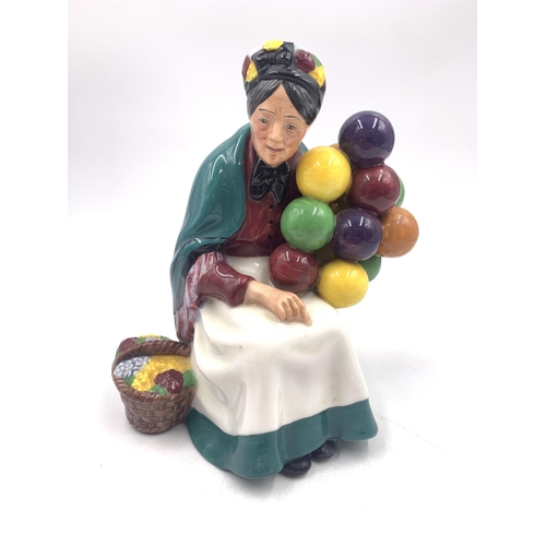 334 - A Royal Doulton The Old Balloon Seller figurine - HN1315