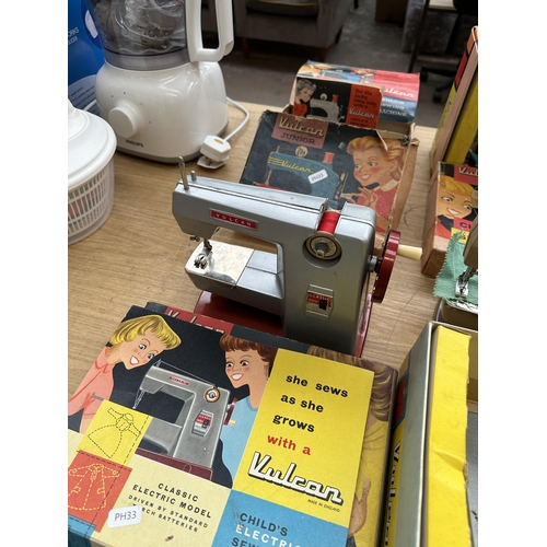 860 - Three boxed mid 20th century Vulcan child's sewing machines, one Classic, one Kantess with instructi... 