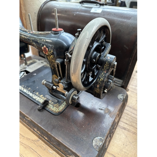 865 - A cased early 20th century Bradbury & Company Limited hand-crank sewing machine (serial number 18953... 