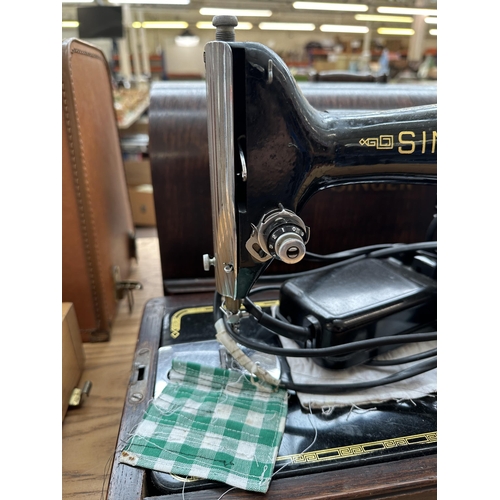 867 - A cased 1950 Singer 201K electric sewing machine with accessories and foot pedal