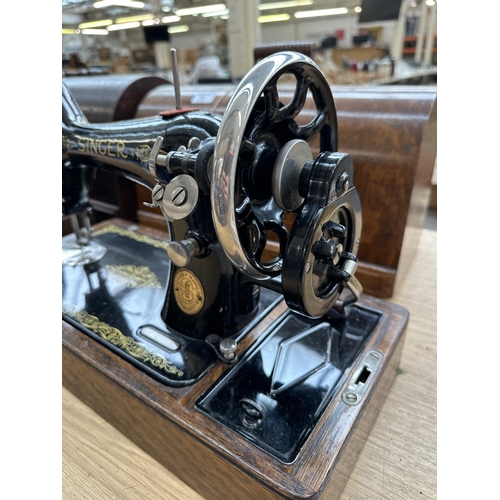 868 - A cased 1929 Singer 99K hand crank sewing machine