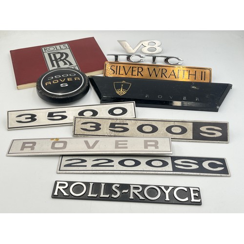 2301 - A collection of automobilia to include Rolls-Royce Silver Wraith II car badge, 3500 Rover S car badg... 