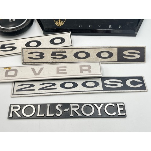 2301 - A collection of automobilia to include Rolls-Royce Silver Wraith II car badge, 3500 Rover S car badg... 