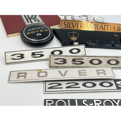 2301 - A collection of automobilia to include Rolls-Royce Silver Wraith II car badge, 3500 Rover S car badg... 